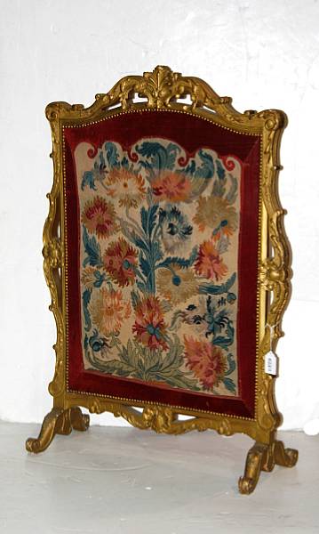 Appraisal: A Rococo style giltwood needlepoint and velvet upholstered fire screen