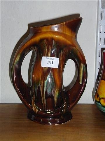 Appraisal: A VALLAURIS TWO HANDLED POTTERY VASE in brown yellow and