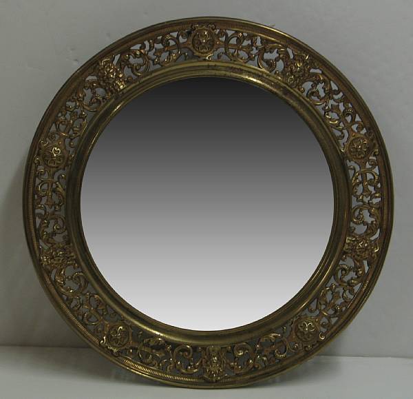 Appraisal: A Renaissance Revival brass framed circular mirror late thearly th