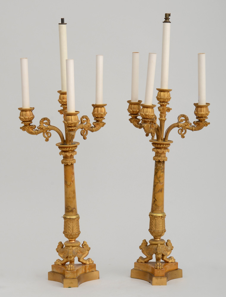 Appraisal: PAIR OF CHARLES X STYLE GILT-BRONZE AND MARBLE FOUR-LIGHT CANDELABRA