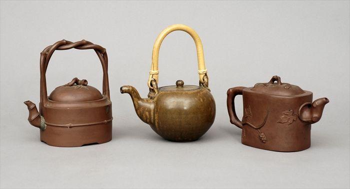 Appraisal: Two Chinese Yixing Teapots Together with a glazed stoneware teapot