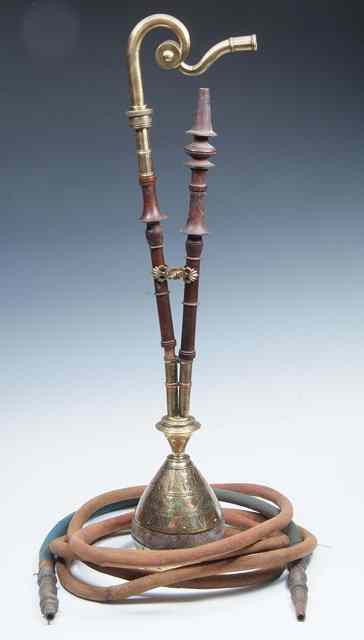 Appraisal: A PERSIAN ISLAMIC HOOKAH BASE with engraved decoration and pipe