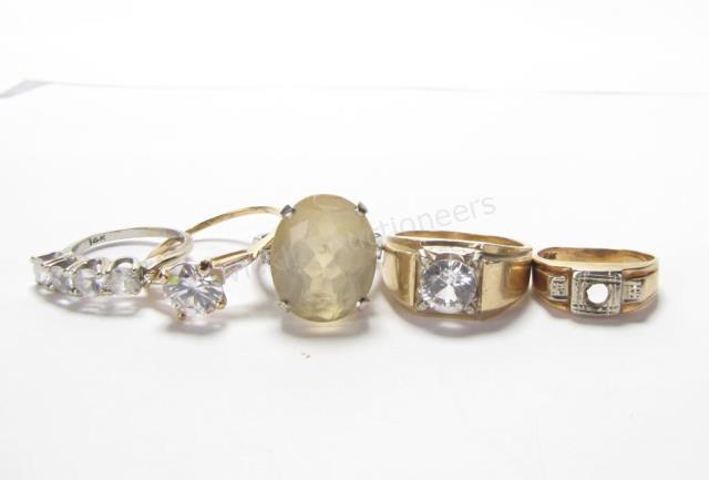 Appraisal: Five K yellow gold rings with simulated stones one missing