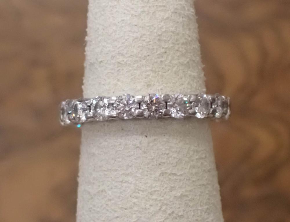 Appraisal: ESTATE DIAMOND AND PLATINUM ETERNITY BAND set with round brilliant-cut