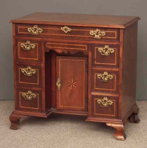 Appraisal: An th Century mahogany kneehole dressing table inlaid throughout with