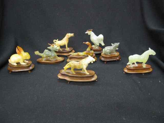 Appraisal: Collection of Carved Jade Figurines ofanimals on custom wooden stands