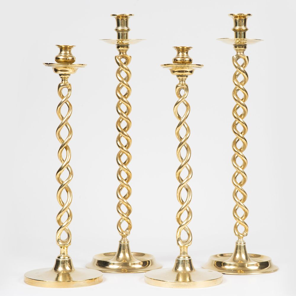 Appraisal: Two Pairs of Brass Candlesticks with Twisted Stems The larger