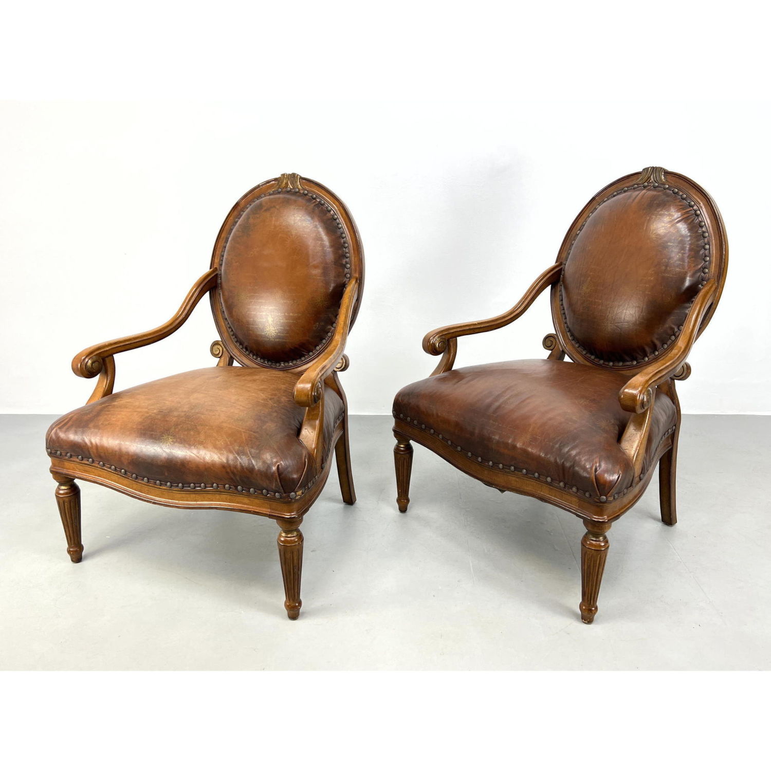 Appraisal: Pr COUNCILL Brown Leather Open Arm Chairs Carved frames Brass