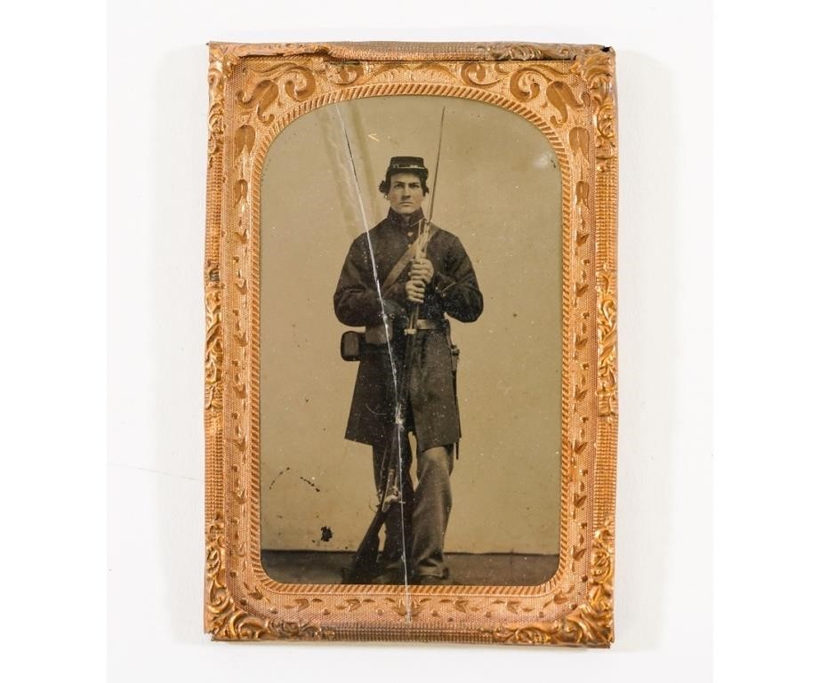 Appraisal: Tintype of a Civil War Union soldier holding a musket