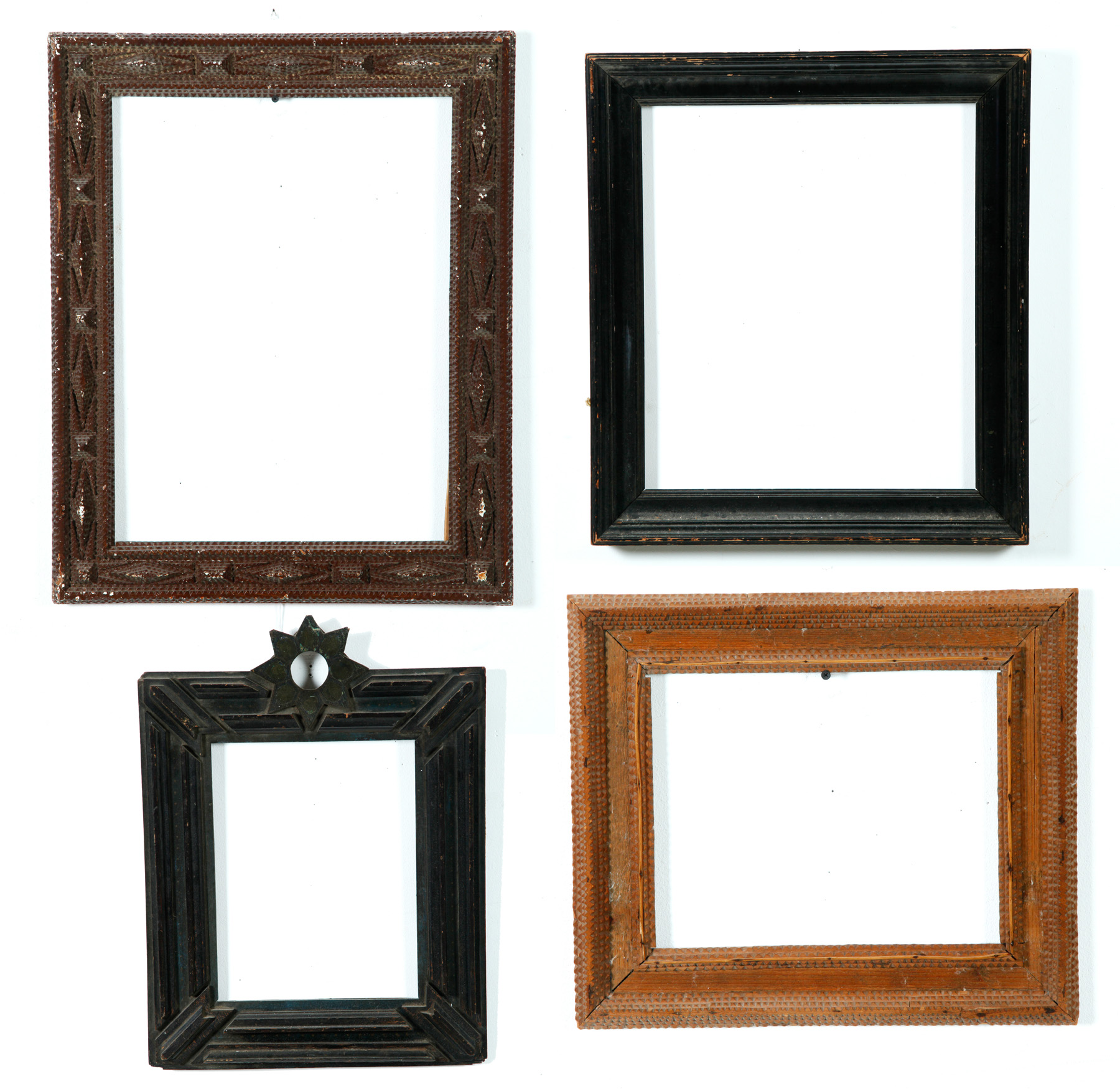 Appraisal: FOUR AMERICAN FRAMES Nineteenth- th century Two tramp art x