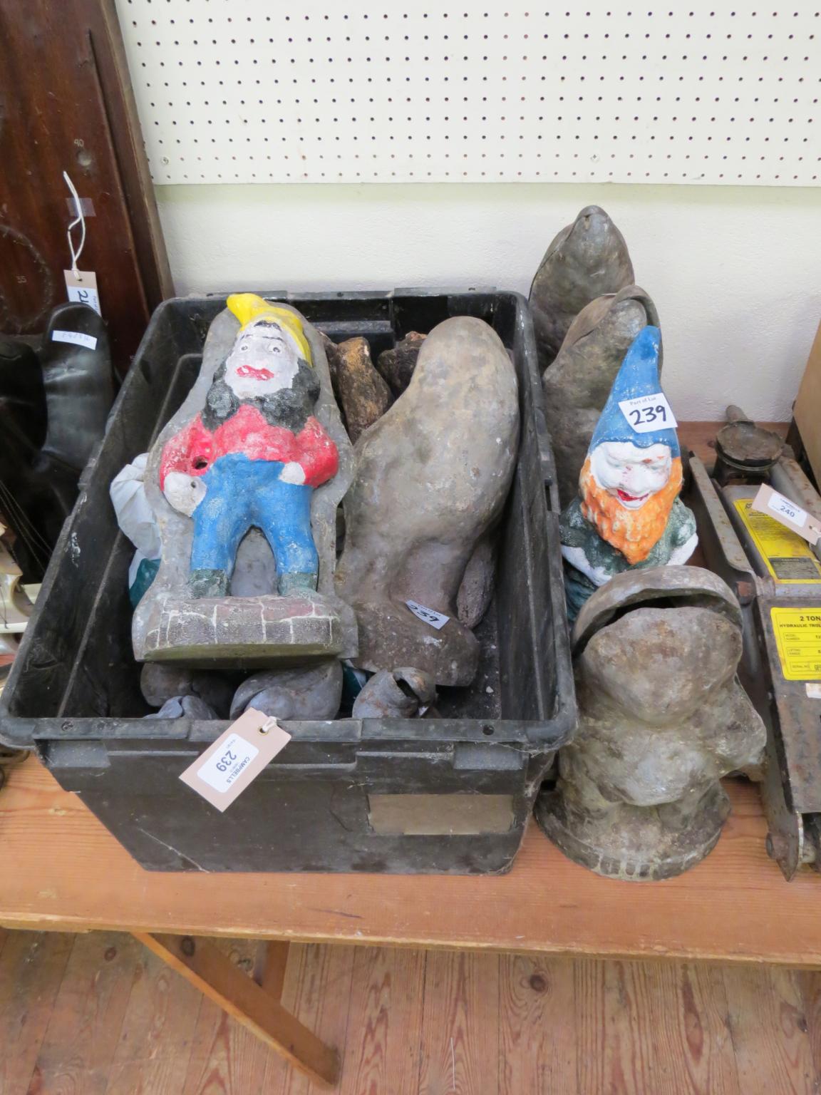 Appraisal: Two cast and painted metal garden gnomes in two cast