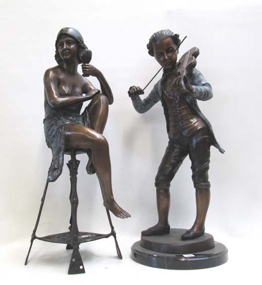 Appraisal: TWO FIGURAL BRONZE SCULPTURES depicting a standing man playing the