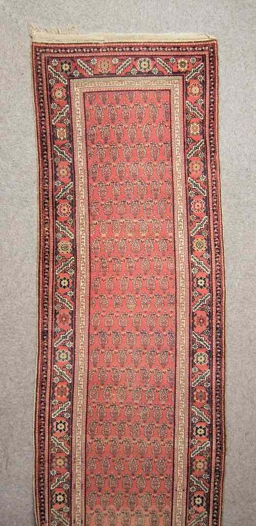 Appraisal: An antique Hamadan runner woven in colours with endless boteh