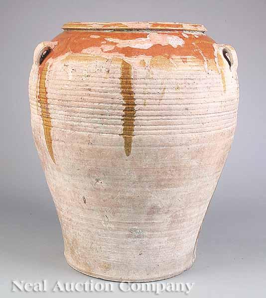 Appraisal: A Provincial Terracotta Oil Jar c with remnants of orange