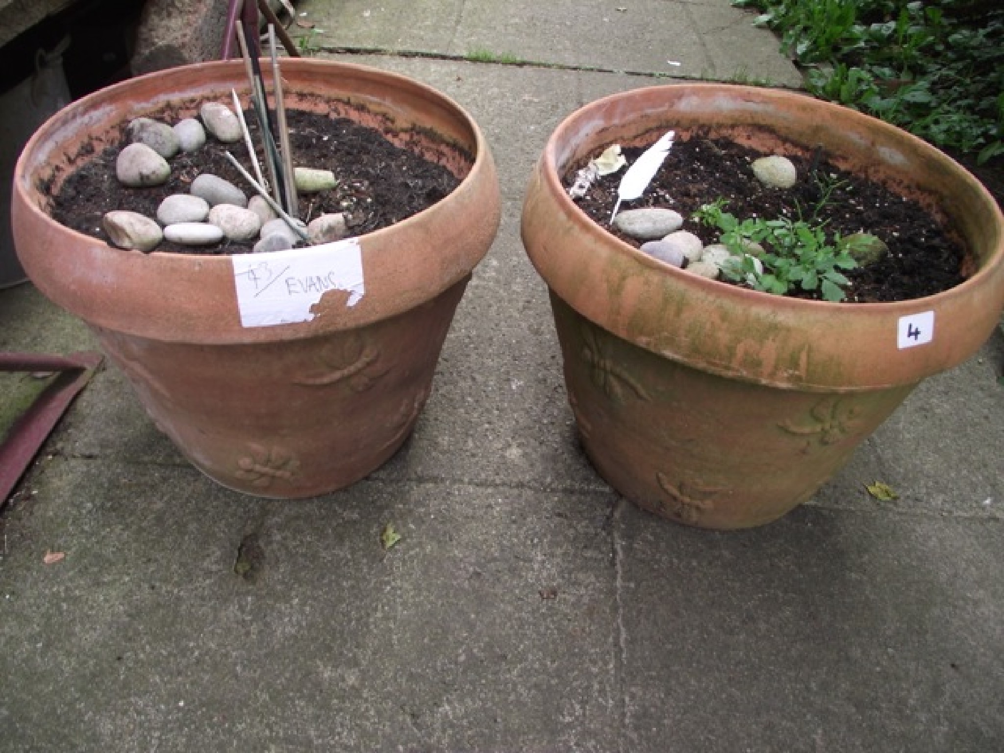 Appraisal: A pair of contemporary terracotta garden planters of circular tapered