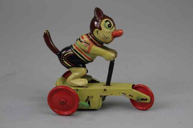 Appraisal: CAT RIDING SCOOTER Lithographed tin colorful toy depicts three wheel