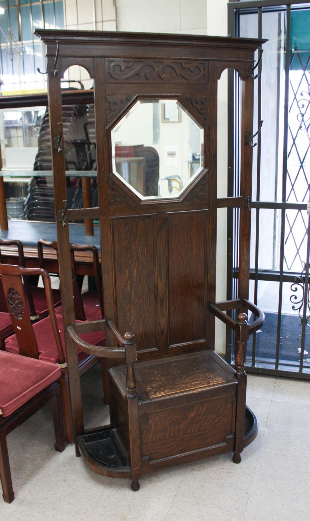 Appraisal: ENGLISH OAK HALLSTAND having an octagonal mirror over double umbrella