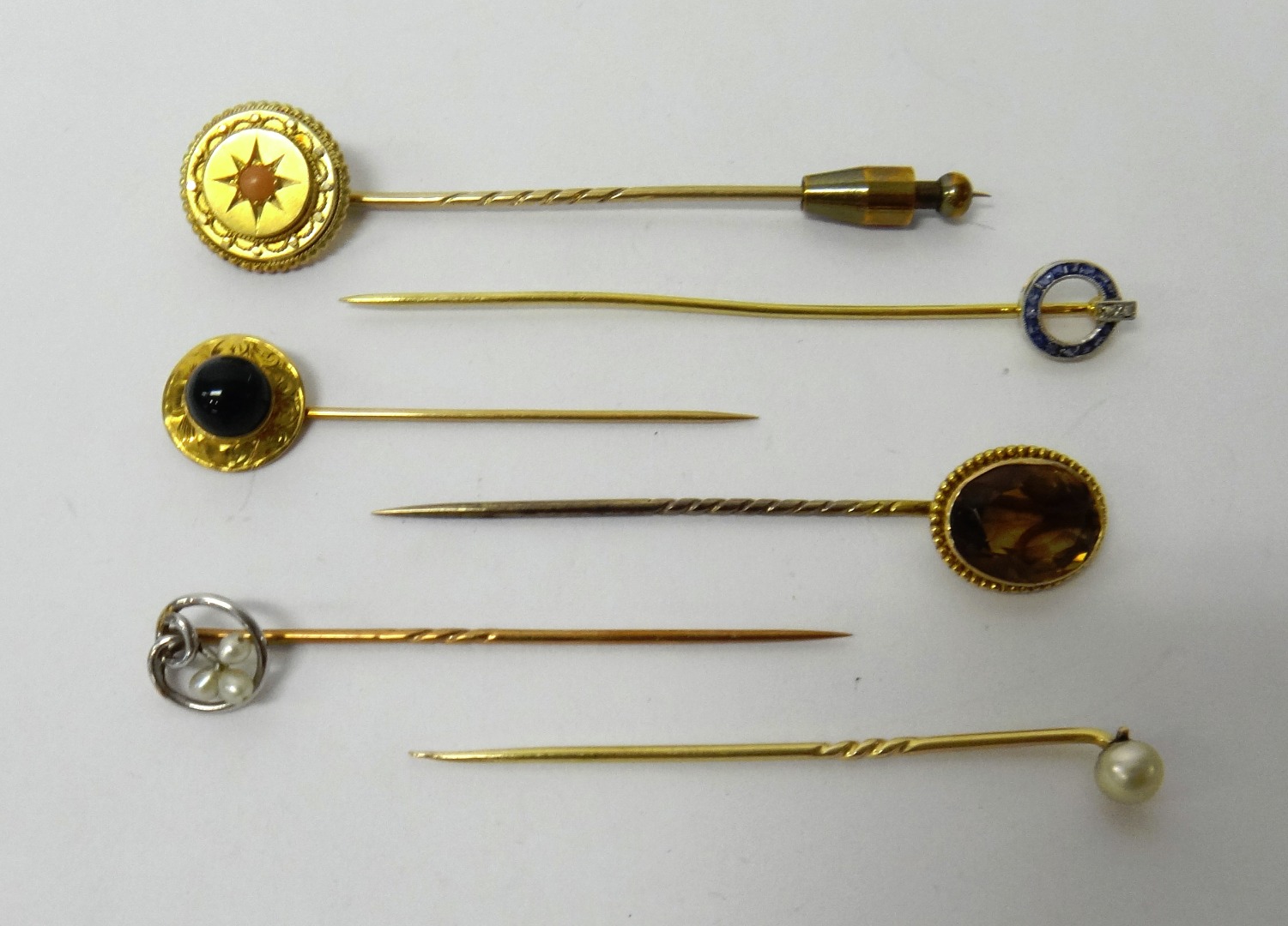 Appraisal: A French gold sapphire and diamond set stick pin having