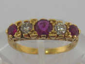 Appraisal: A ruby and diamond five stone ring the central round