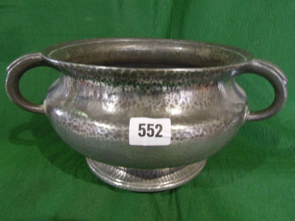 Appraisal: A -handled pewter bowl with a hammered finish stamped to