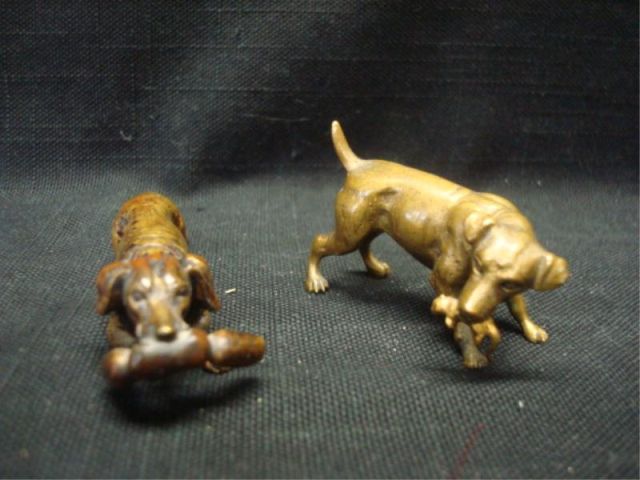 Appraisal: Bronze Dogs Eating Prey Both from a Port Washington NY