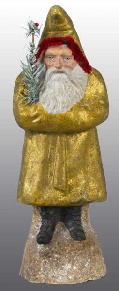 Appraisal: Gold Santa Belsnickle Holding Tree Description No damage Provenance Joyce