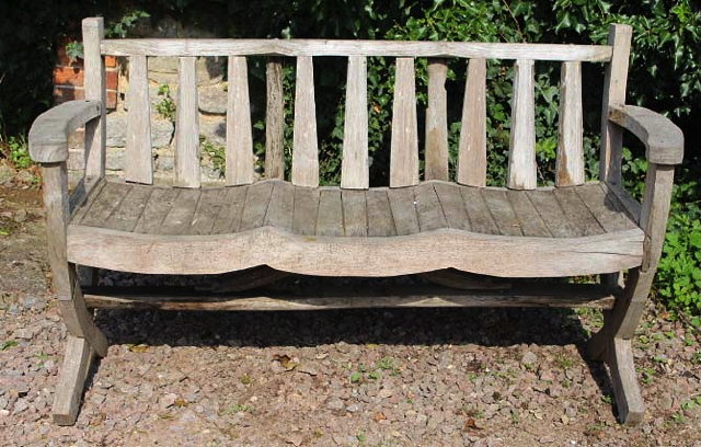 Appraisal: A TEAK GARDEN BENCH with triple scallop seat cm wide