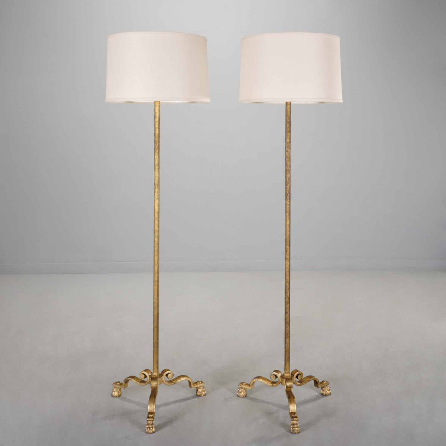 Appraisal: MAISON BAGUES PAIR GILT IRON FLOOR LAMPS c s square