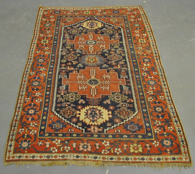 Appraisal: - Center hall oriental carpet with two geometric medallions x