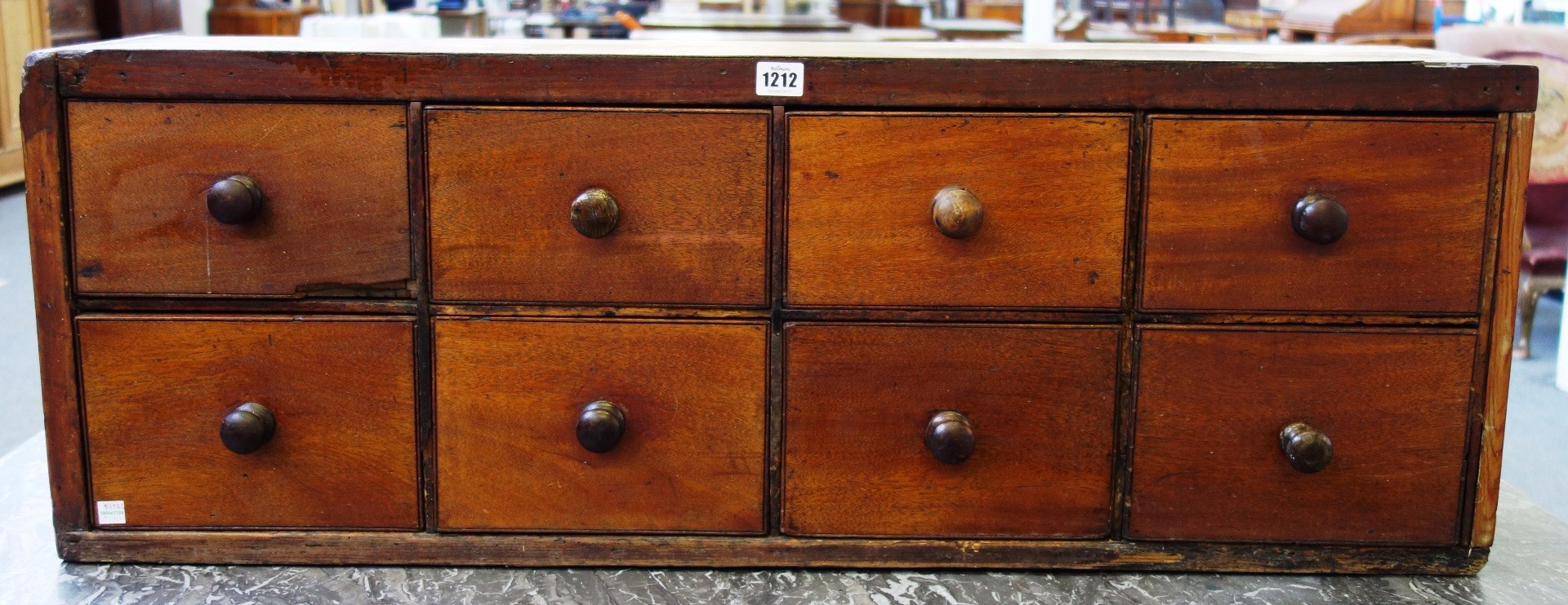 Appraisal: A bank of eight th century mahogany drawers with turned