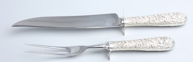 Appraisal: Roast knife and fork carver Sterling handle and guard with