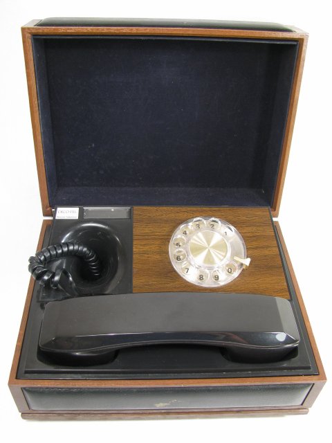 Appraisal: Rotary dial phone enclosed in the box The box itself