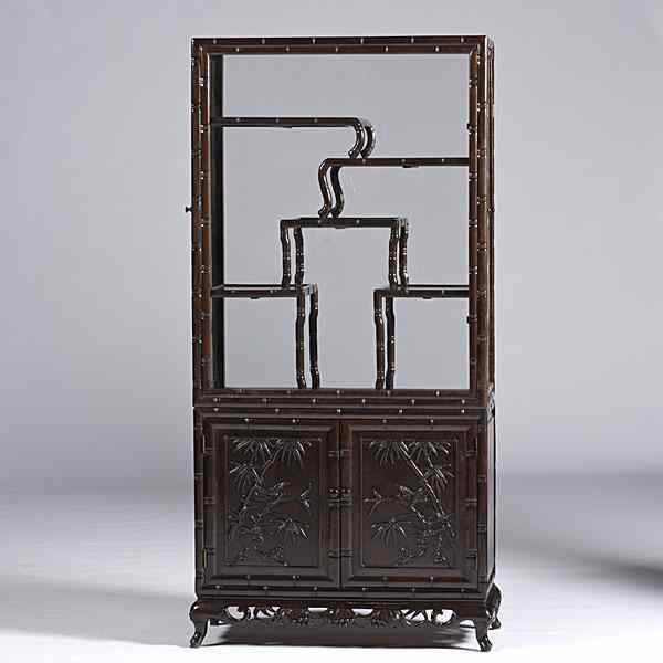 Appraisal: Chinese Curio Cabinet Chinese A rosewood curio cabinet with glass