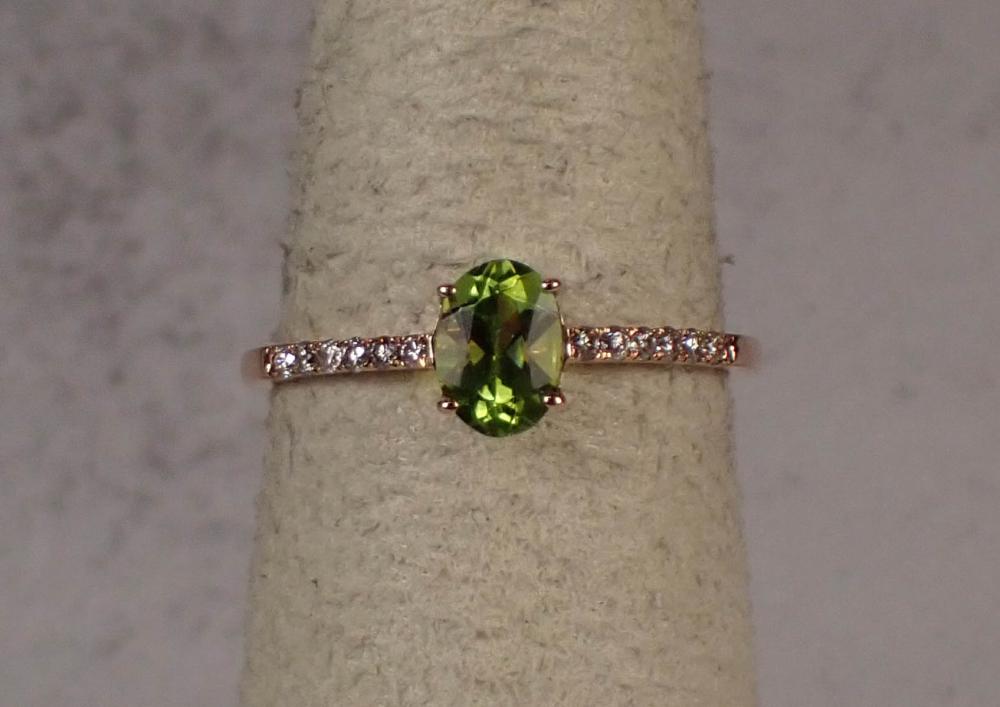 Appraisal: PERIDOT DIAMOND AND FOURTEEN KARAT GOLD RING The rose gold