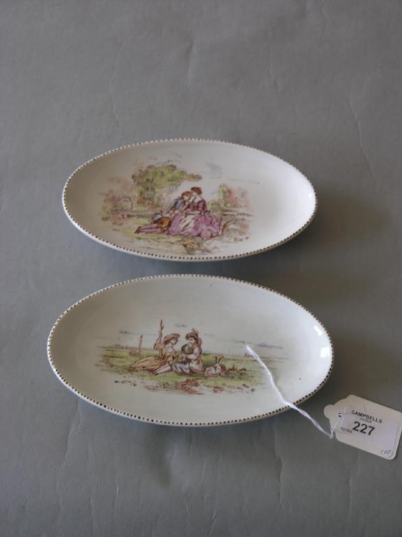 Appraisal: A pair of French earthenware dishes oval shape enamelled in