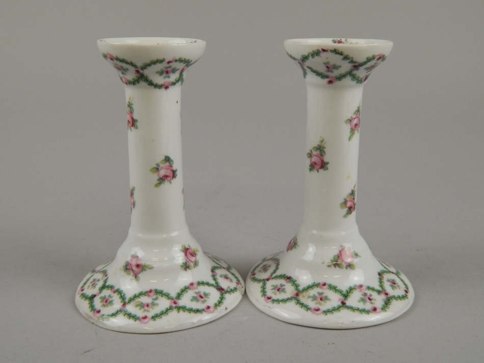 Appraisal: A pair of early thC Limoges style porcelain candlesticks each