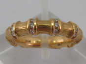 Appraisal: A yellow metal tests carat gold bamboo design diamond ring