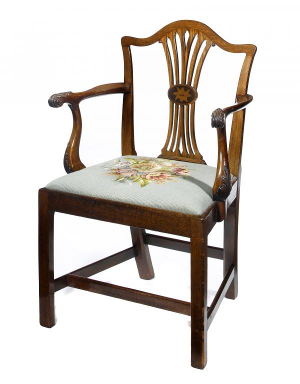 Appraisal: A GEORGE III FRUITWOOD ARMCHAIR the pierced splat with central