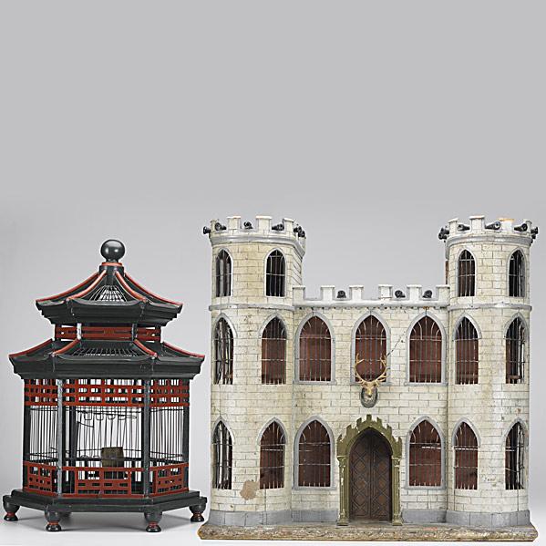 Appraisal: TWO DECORATIVE BIRD CAGESOne designed as a castle with turrets