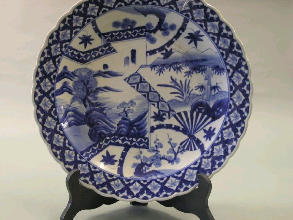 Appraisal: A large Japanese porcelain charger painted with an aesthetic plant