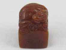 Appraisal: A Chinese brown stone seal with mythical beast ht cm