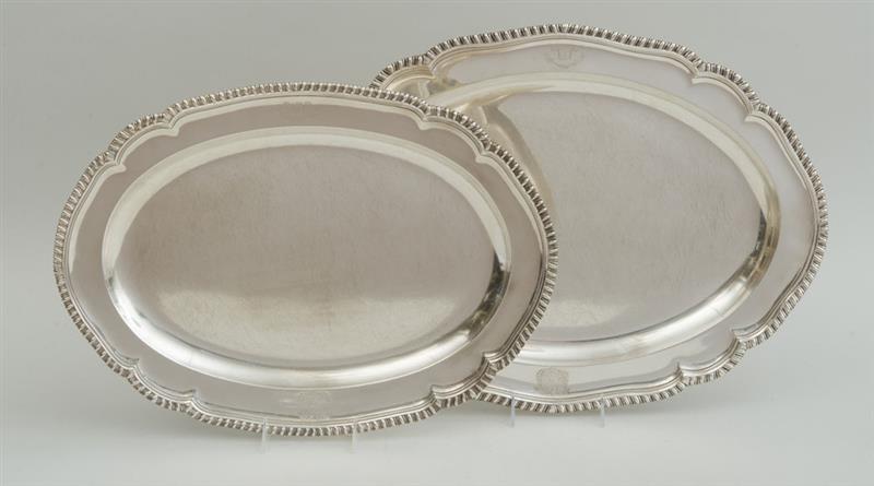 Appraisal: PAIR OF GEORGE III ARMORIAL SILVER GRADUATED MEAT DISHES Possibly