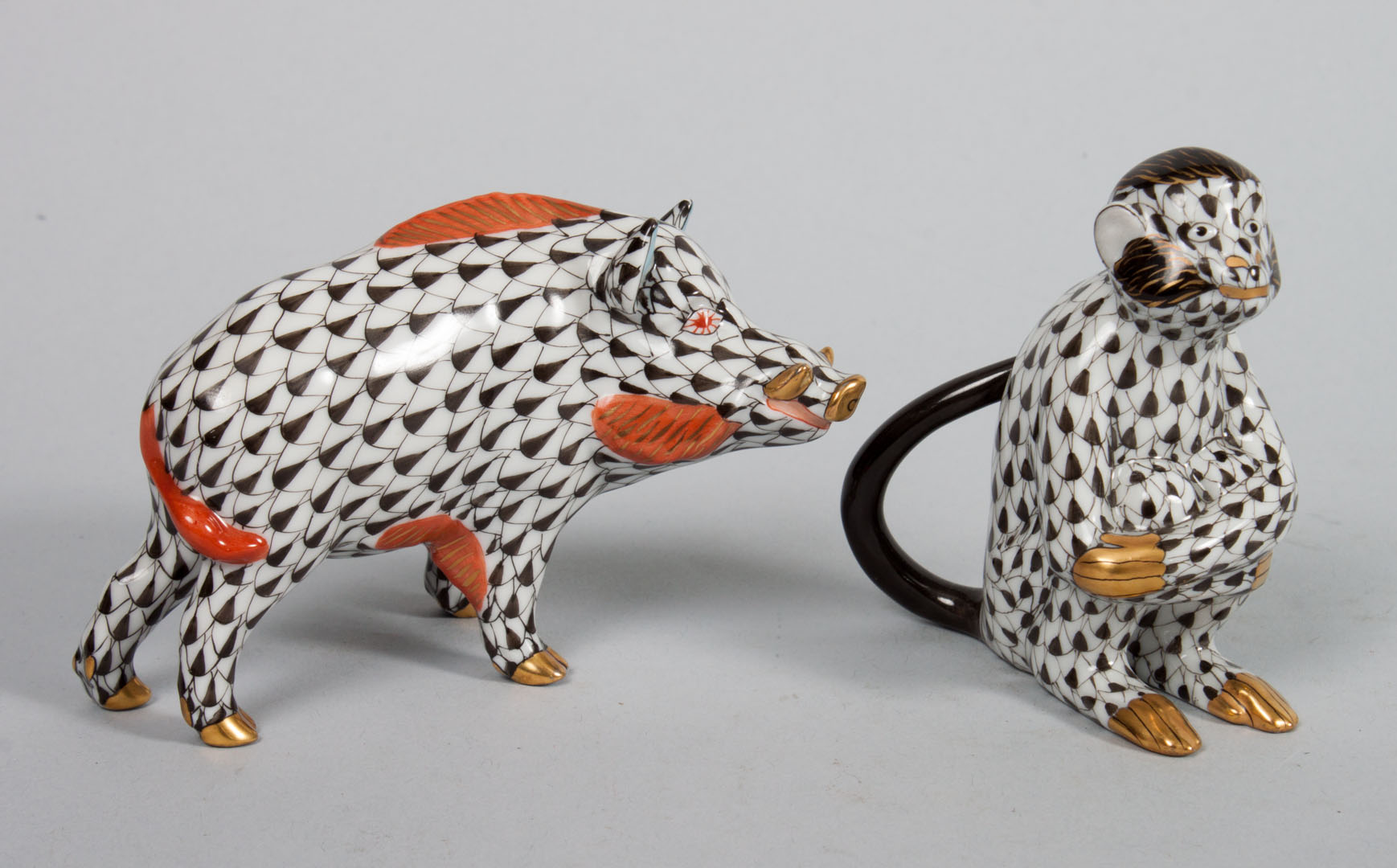 Appraisal: Two Herend porcelain animals in the Black Fishnet pattern including