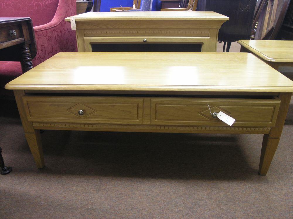 Appraisal: A modern Belgian oak coffee table with dentil mouldings fitted