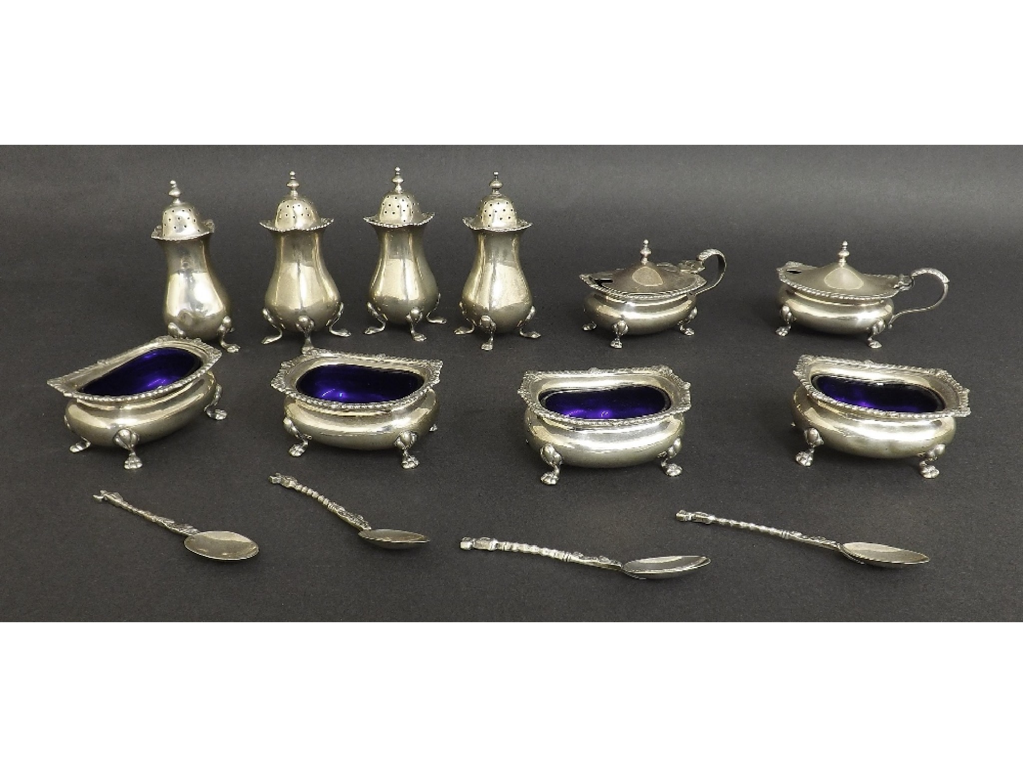 Appraisal: Extensive s silver cruet set comprising four peppers four salts