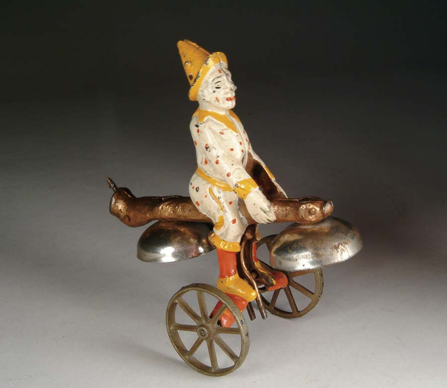 Appraisal: CLOWN PUSH CHIME BELL TOY Manufactured by Watrous Mfg Co