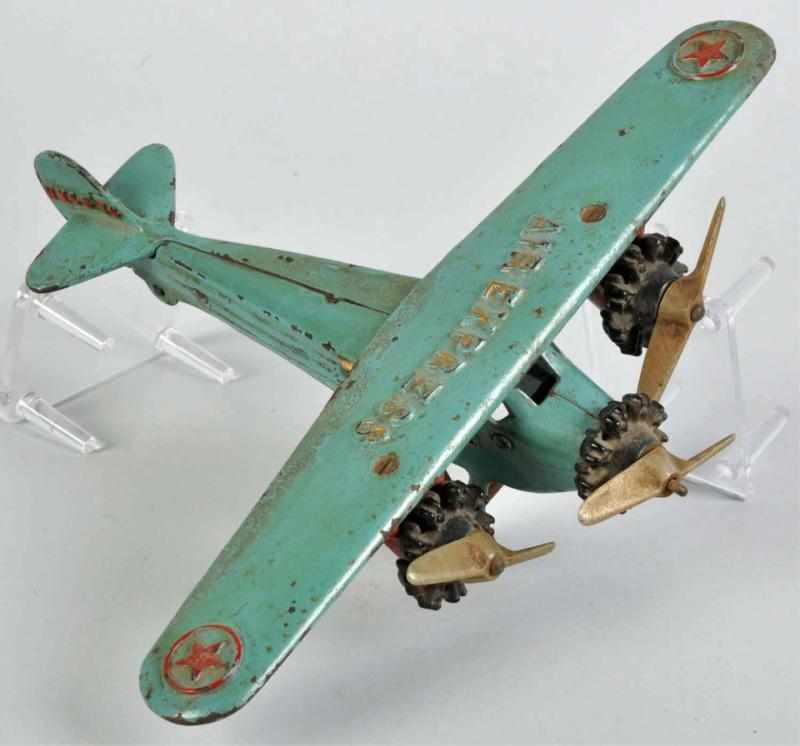 Appraisal: Cast Iron Dent Tri-Motor Air Express Airplane Toy Description American