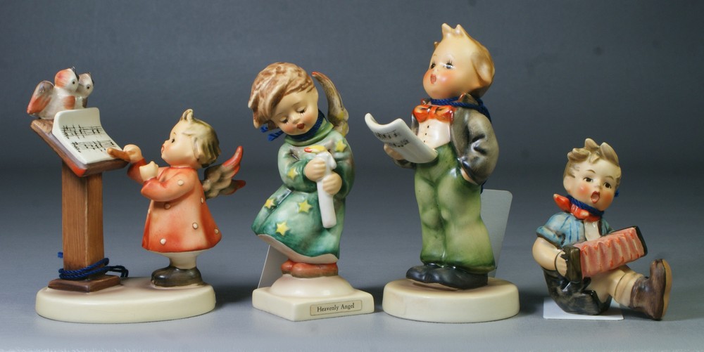 Appraisal: Goebel Hummel figurines Heavenly Angel Hum Boy with Accordion Hum