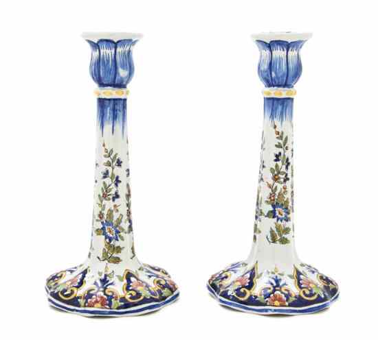 Appraisal: A Pair of Delft Porcelain Candlesticks having an inverted bell