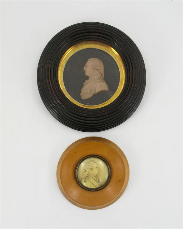 Appraisal: Two circular wax profile portraits